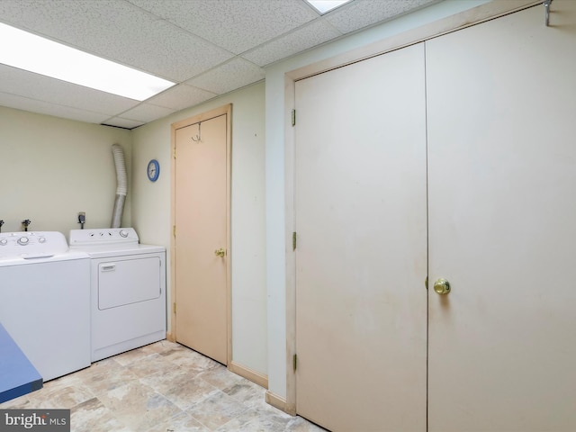 clothes washing area with separate washer and dryer