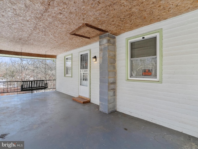 doorway to property featuring a patio