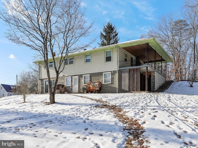 view of snow covered house