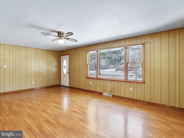 interior space with light hardwood / wood-style floors and ceiling fan