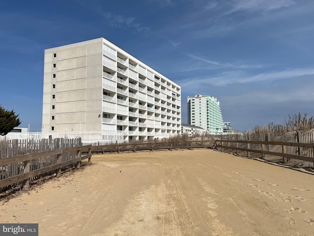 view of building exterior featuring fence