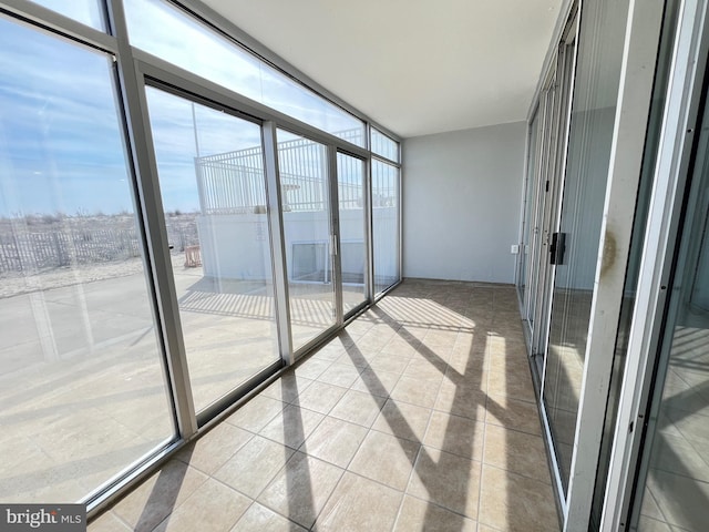 unfurnished sunroom with a healthy amount of sunlight