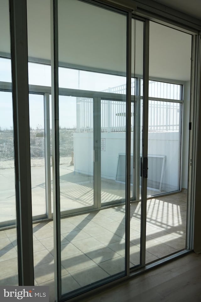 doorway to outside with french doors and wood finished floors