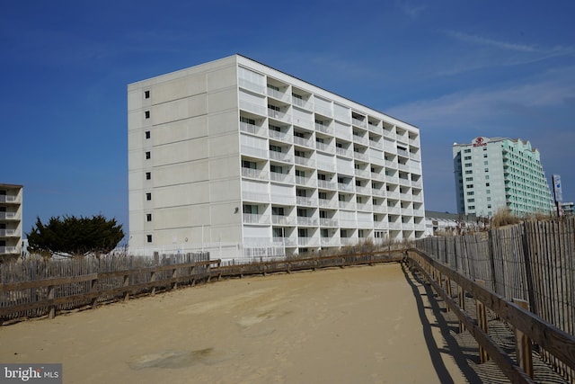 view of property with fence