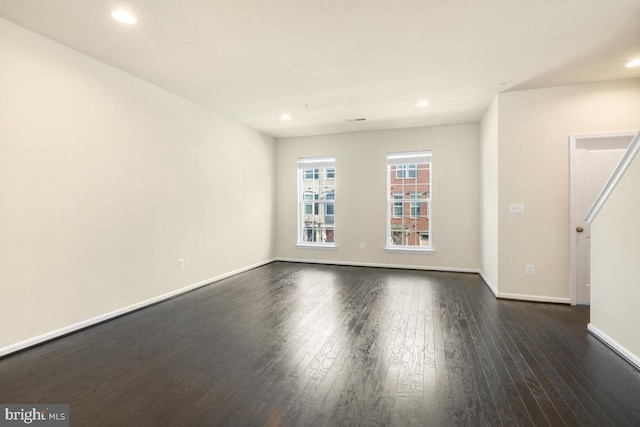 unfurnished room featuring dark hardwood / wood-style floors