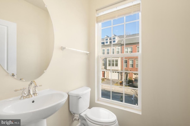 bathroom featuring sink and toilet