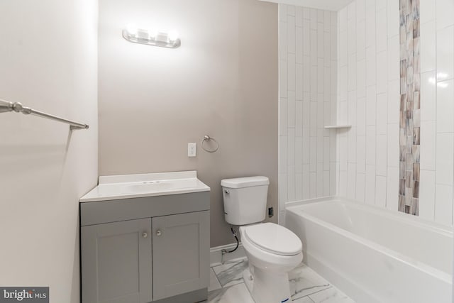 bathroom featuring baseboards, toilet, marble finish floor, vanity, and shower / bathing tub combination