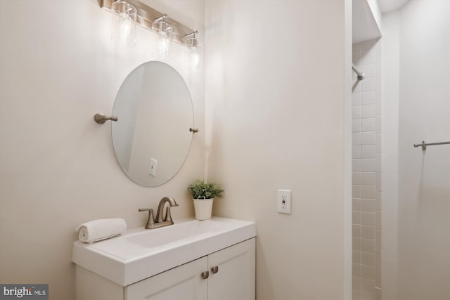 bathroom featuring vanity and a shower