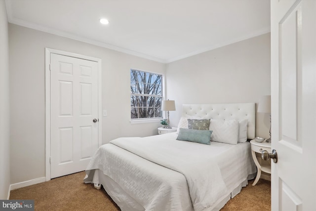 carpeted bedroom with crown molding