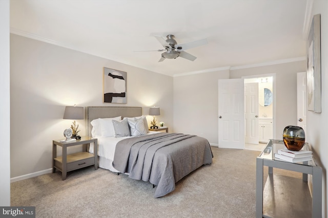 carpeted bedroom featuring ceiling fan, ornamental molding, and ensuite bathroom