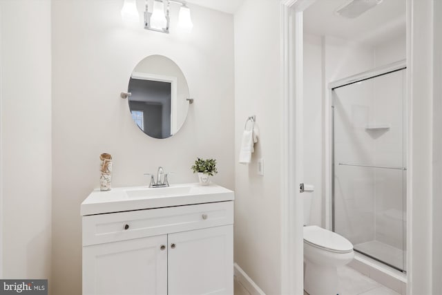 bathroom with vanity, toilet, and walk in shower