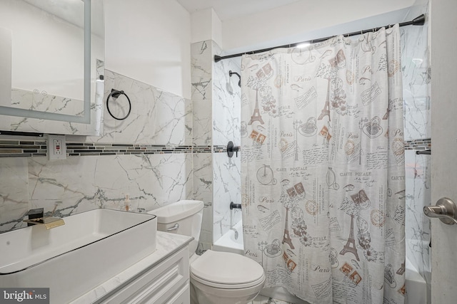 full bathroom featuring vanity, tile walls, shower / tub combo with curtain, and toilet