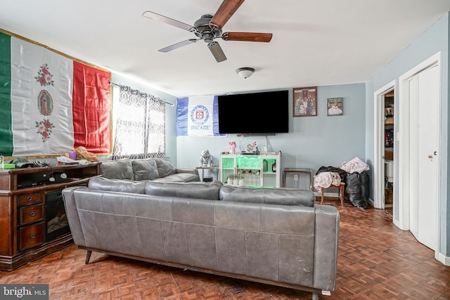 living room with parquet flooring and ceiling fan