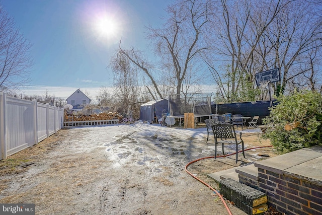 view of yard with a trampoline