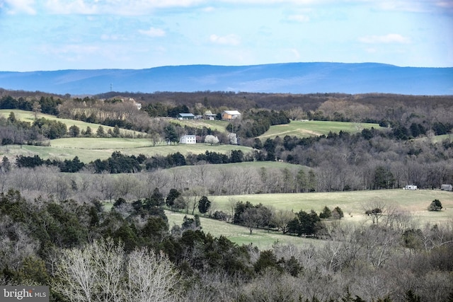 view of mountain feature with a rural view