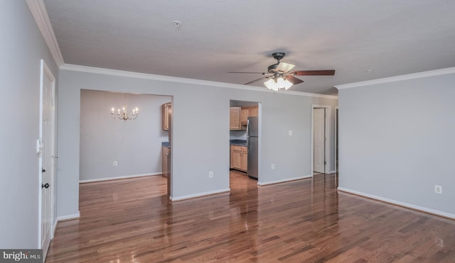 unfurnished living room featuring crown molding, ceiling fan with notable chandelier, a textured ceiling, and dark hardwood / wood-style flooring