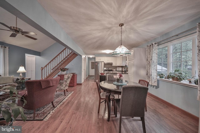 dining area featuring light hardwood / wood-style floors and ceiling fan