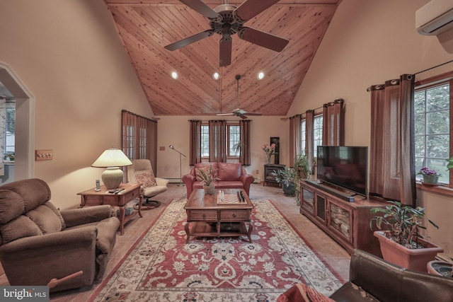 living room with ceiling fan, a healthy amount of sunlight, high vaulted ceiling, and an AC wall unit