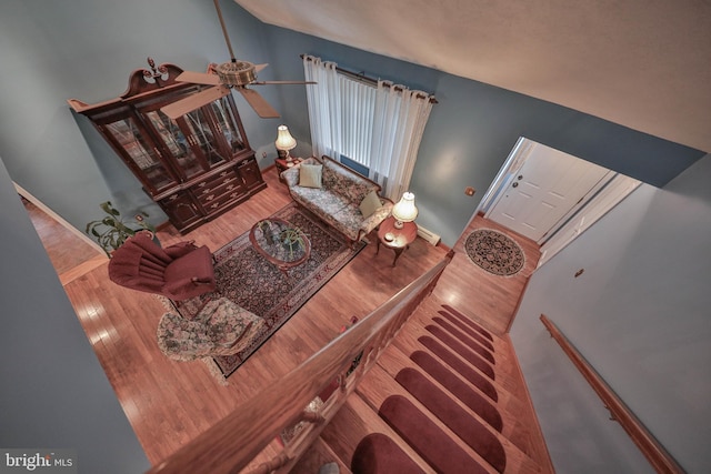 living room featuring hardwood / wood-style flooring and lofted ceiling