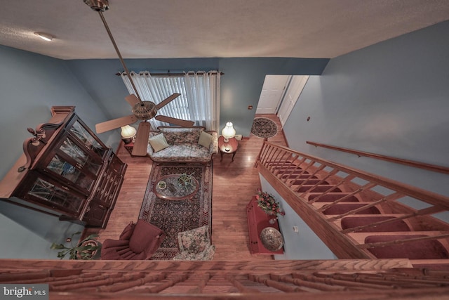 interior space with wood-type flooring and a textured ceiling