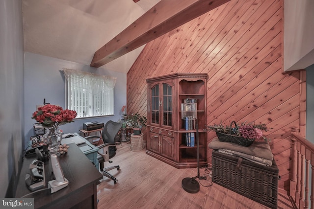 office area with lofted ceiling with beams, light wood-type flooring, and wood walls