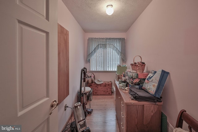 interior space with hardwood / wood-style flooring and a textured ceiling