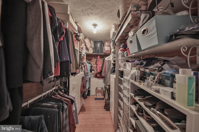 walk in closet featuring light hardwood / wood-style floors