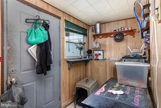 laundry room with laundry area and wooden walls