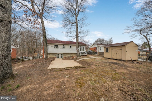 back of house with an outbuilding, french doors, entry steps, fence, and a shed