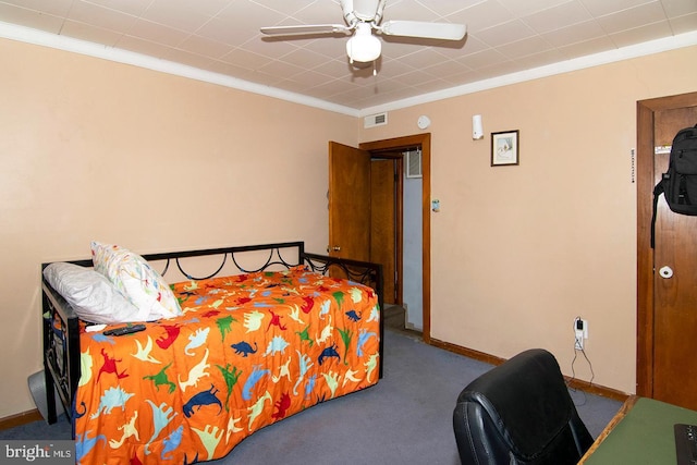 bedroom featuring carpet, visible vents, ornamental molding, and baseboards