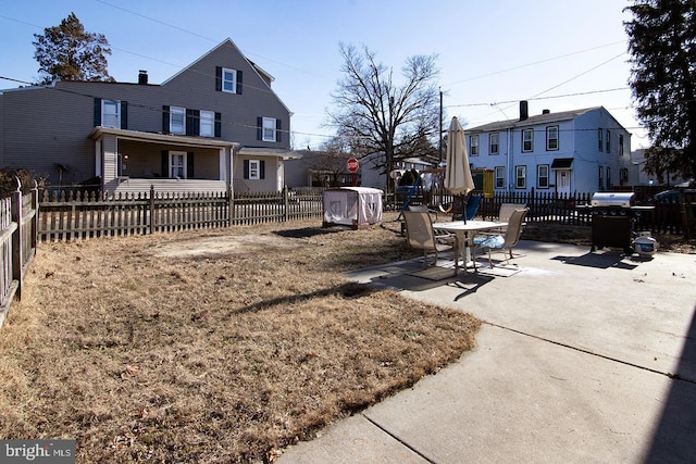 view of yard featuring a fenced front yard and a patio