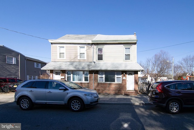 view of front of property featuring brick siding