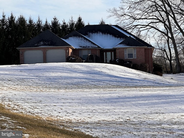 ranch-style house featuring a garage