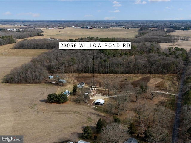 birds eye view of property with a rural view