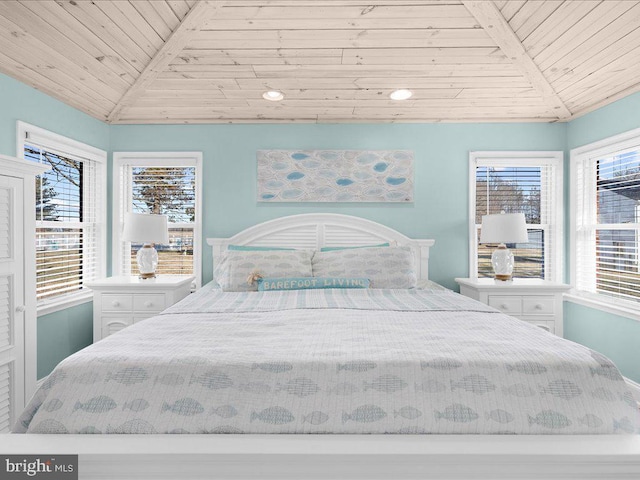 bedroom with wood ceiling and vaulted ceiling