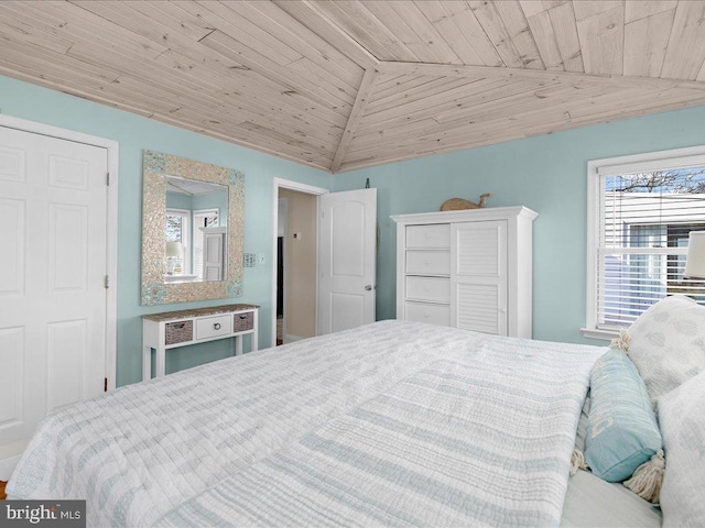 bedroom with lofted ceiling and wooden ceiling