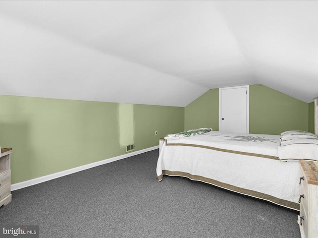 carpeted bedroom with vaulted ceiling