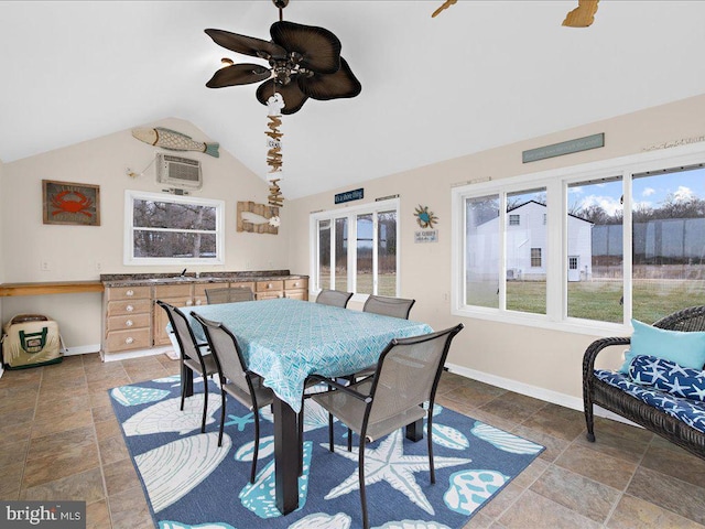 dining area featuring vaulted ceiling and ceiling fan