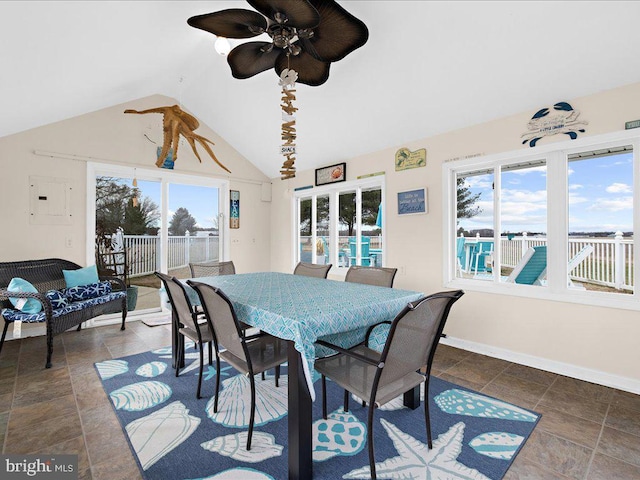 dining space featuring lofted ceiling, electric panel, and ceiling fan