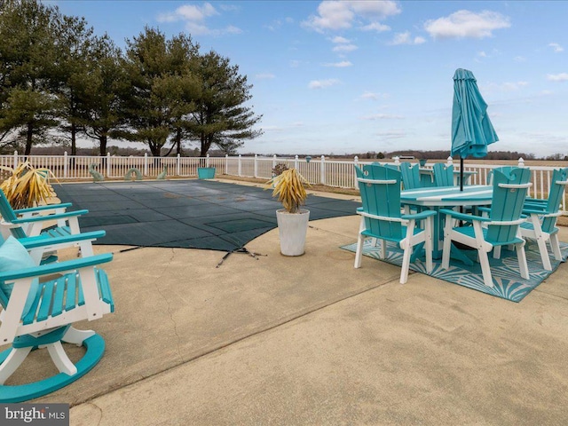 view of swimming pool featuring a patio area