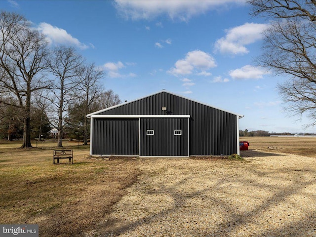 view of outdoor structure with a rural view