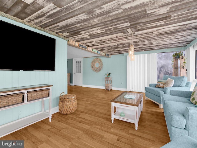 living room featuring hardwood / wood-style flooring and wooden ceiling