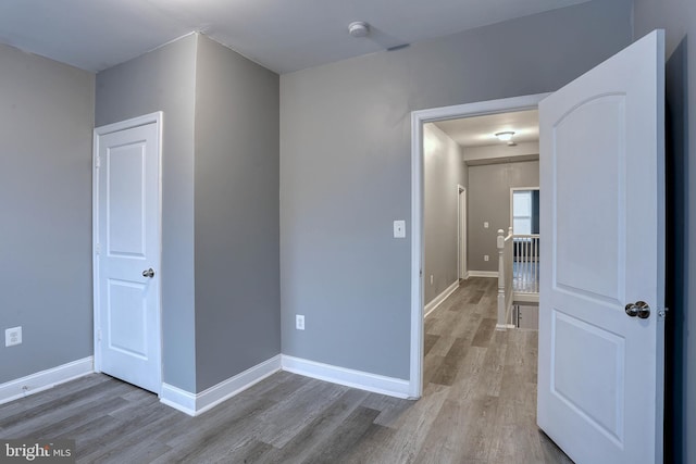 unfurnished room featuring wood-type flooring