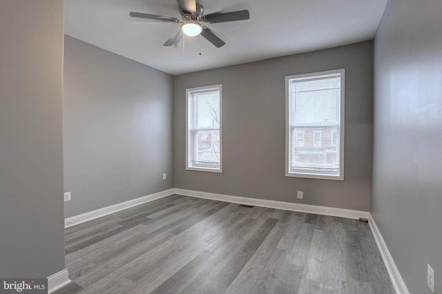 unfurnished room featuring ceiling fan and wood-type flooring