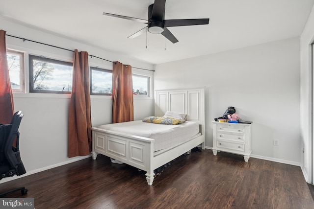 bedroom with ceiling fan and dark hardwood / wood-style flooring