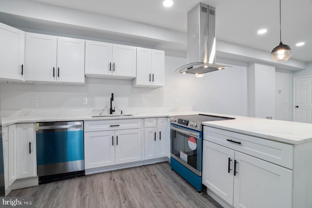 kitchen featuring island exhaust hood, stainless steel appliances, sink, and white cabinets