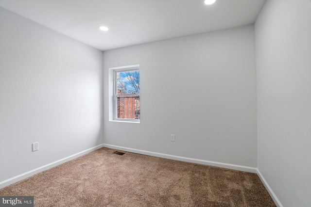 unfurnished room with carpet floors