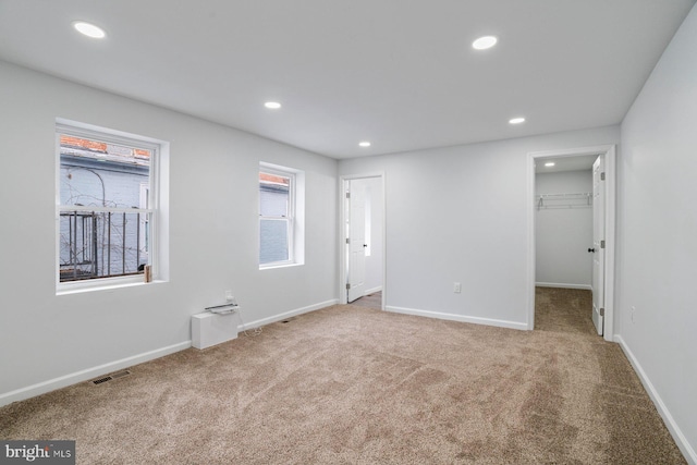 spare room featuring carpet floors