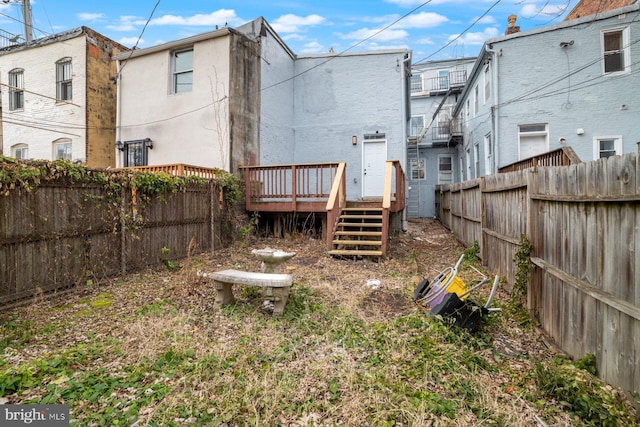 rear view of house with a wooden deck