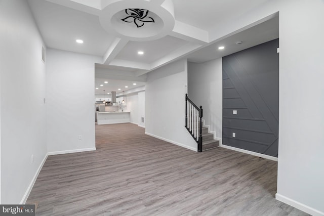 interior space with hardwood / wood-style flooring and beam ceiling